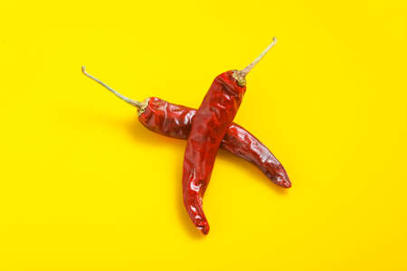 Dry Red chilli on yellow background.の写真素材
