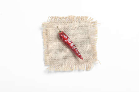 Dried red chilli on white background.の写真素材