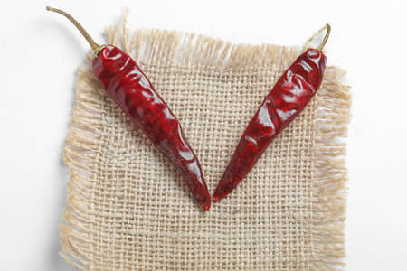 Dried red chilli on white background.の写真素材