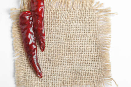 Dried red chilli on white background.の写真素材