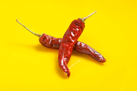 Dry Red chilli on yellow background.の写真素材