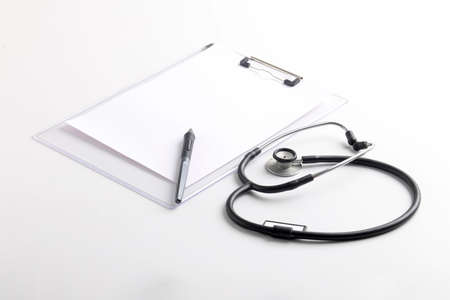 Black stethoscope lying on the diary, medicine.の写真素材
