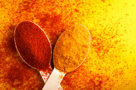 Turmeric and chili powder in spoonの写真素材