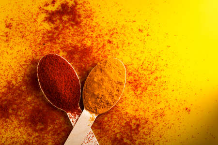 Turmeric and chili powder in spoonの写真素材