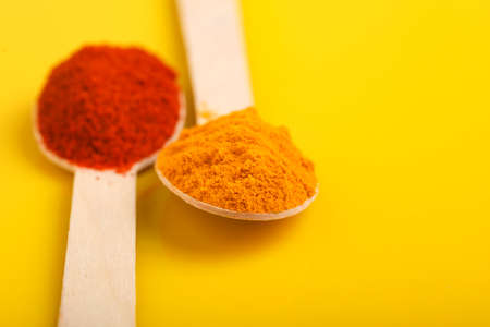 Turmeric and chili powder in a spoonの写真素材