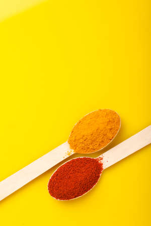 Turmeric and chili powder in a spoonの写真素材