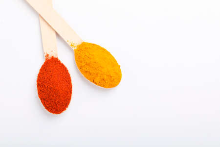 Turmeric and chili powder in a spoonの写真素材