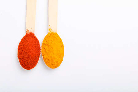 Turmeric and chili powder in a spoonの写真素材