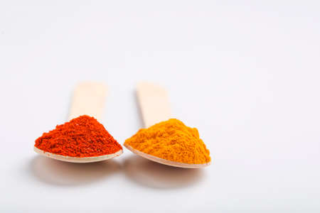 Turmeric and chili powder in a spoonの写真素材