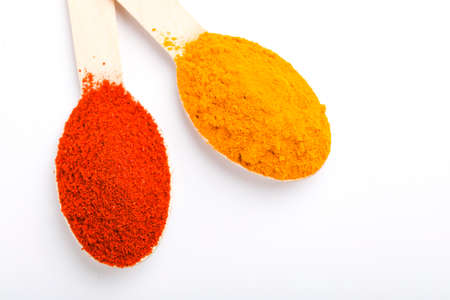 Turmeric and chili powder in a spoonの写真素材