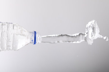 Water bottle splash on whiteの写真素材