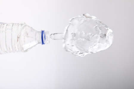 Water bottle splash on whiteの写真素材