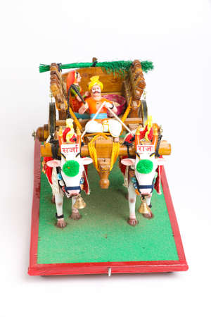 Traditional Indian wooden bull cart and statue of farmer sitting on bull cartの写真素材