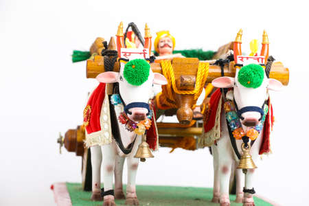 Traditional Indian wooden bull cart and statue of farmer sitting on bull cartの写真素材