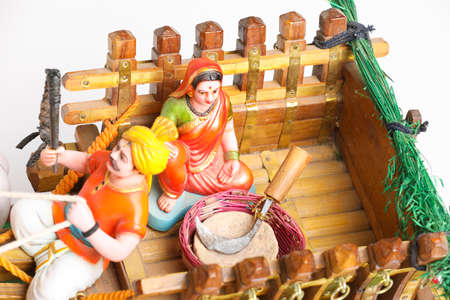 Traditional Indian wooden bull cart and statue of farmers couple sitting on bull cartの写真素材