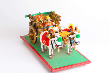 Traditional Indian wooden bull cart and statue of farmer sitting on bull cartの写真素材