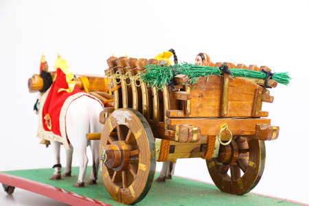 Traditional Indian wooden bull cart and statue of farmer sitting on bull cartの写真素材
