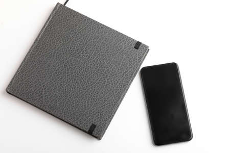 Smartphone & diary on whiteの写真素材