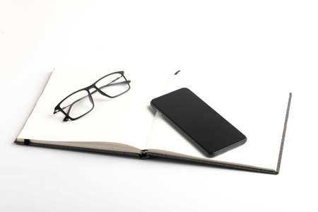 Smartphone,diary and spectaclesの写真素材