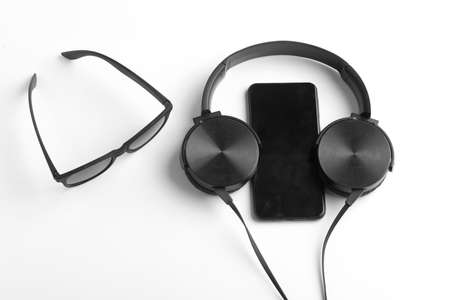 Smartphone and earphone or headphone on whiteの写真素材