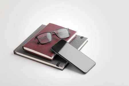 smartphone, diary and spectacles on whiteの写真素材