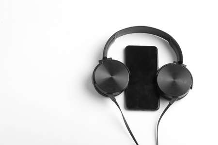 Smartphone and earphone or headphone on whiteの写真素材