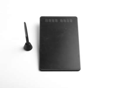 Pen tab and pen on whiteの写真素材
