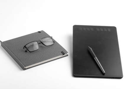 Pen tab, dairy and pen on whiteの写真素材