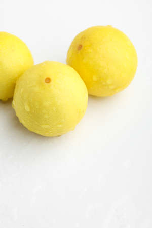 Fresh Yellow lemon on whiteの写真素材