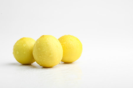 Fresh Yellow lemon on whiteの写真素材