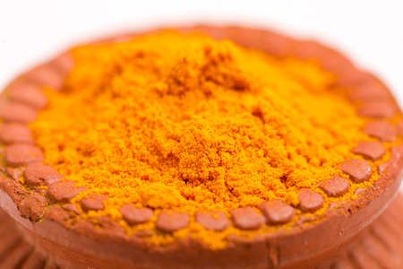 Turmeric powder in clay bowl.の写真素材