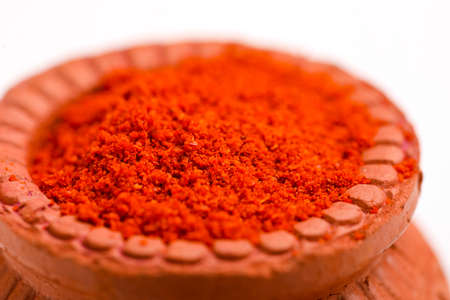 Red chilli powder in a bowl with dry red chilliの写真素材