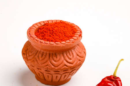 Red chilli powder in a bowl with dry red chilliの写真素材