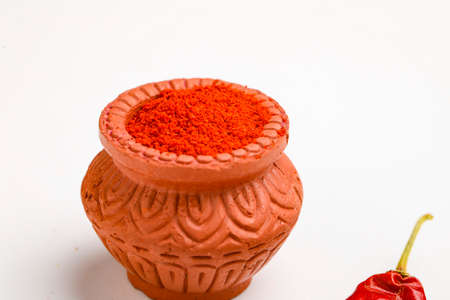 Red chilli powder in a bowl with dry red chilliの写真素材