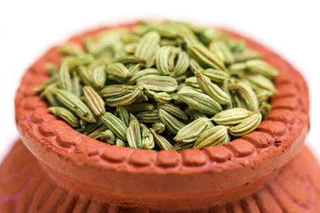 Dried fennel seeds isolated on white backgroundの写真素材