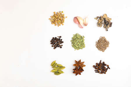 Indian spices and herbs on white background.の写真素材