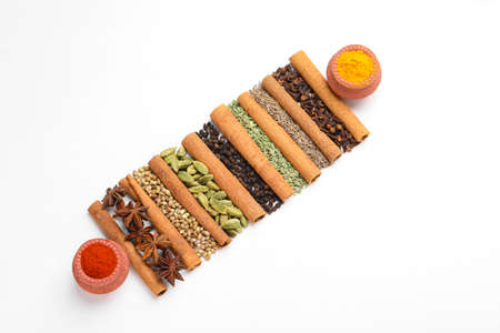 Indian spices and herbs on white background.の写真素材