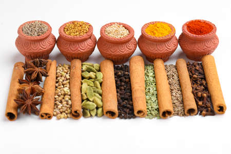Indian spices and herbs on white background.の写真素材