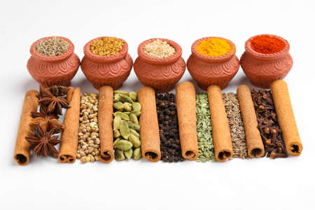 Indian spices and herbs on white background.の写真素材