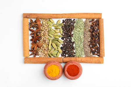 Indian spices and herbs on white background.の写真素材