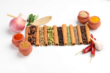 Indian spices and herbs on white background.の写真素材