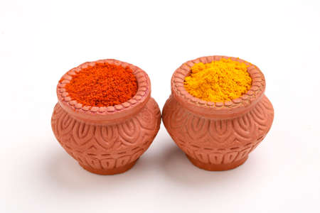 Red chili powder and turmeric powder in bowlの写真素材