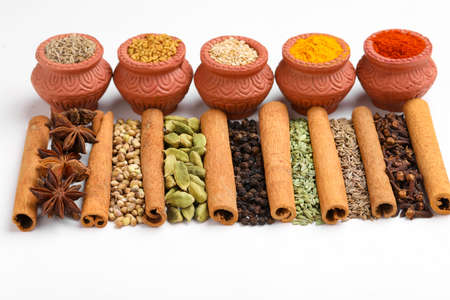 Indian spices and herbs on white background.の写真素材