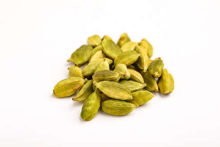 Fresh dried green cardamom seeds spice on white background ,の写真素材