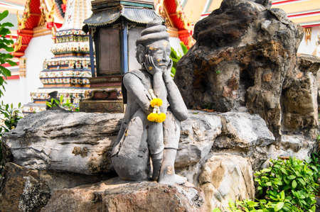 Hermit statue at Phrachetuphon temple in Thailandの写真素材