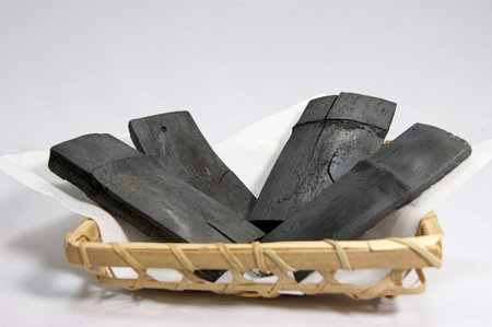 Bamboo charcoal in a bamboo basketの写真素材