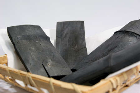 Bamboo charcoal in a bamboo basketの写真素材