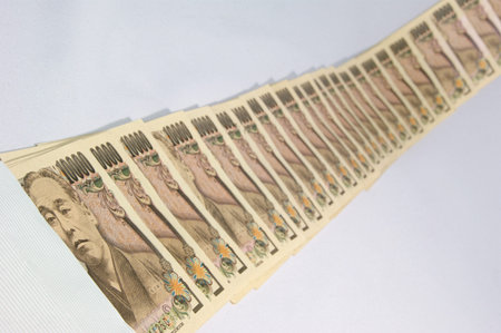 Away from the envelope a lot of 10000 Yen bills