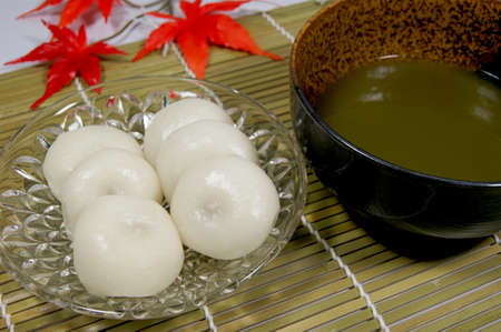 Mitarashi dumplings and green tea in Japanの写真素材