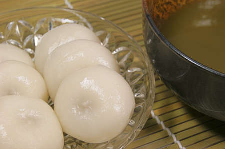 Mitarashi dumplings and green tea in Japanの写真素材